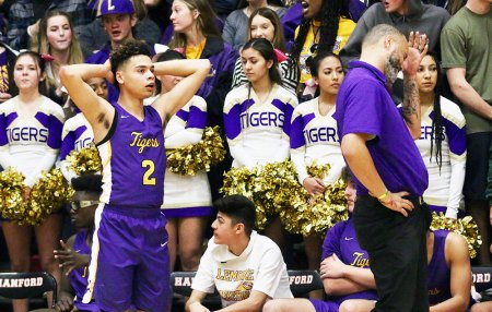 Players, fans and coaches appear frustrated at the end of Wednesday's game in Hanford in which the Bullpups won 62-60, spoiling the Tigers' perfect league campaign.